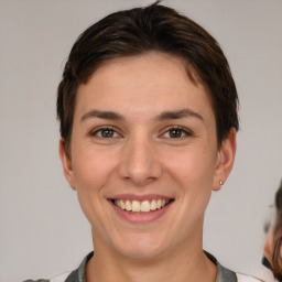 Joyful white young-adult female with short  brown hair and brown eyes