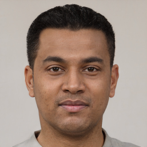 Neutral latino young-adult male with short  black hair and brown eyes