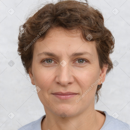 Joyful white adult female with short  brown hair and grey eyes