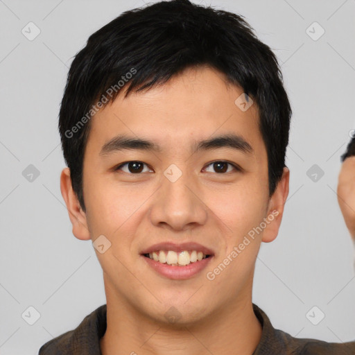 Joyful asian young-adult male with short  black hair and brown eyes