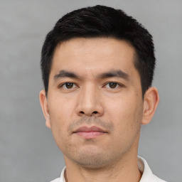 Neutral asian young-adult male with short  black hair and brown eyes