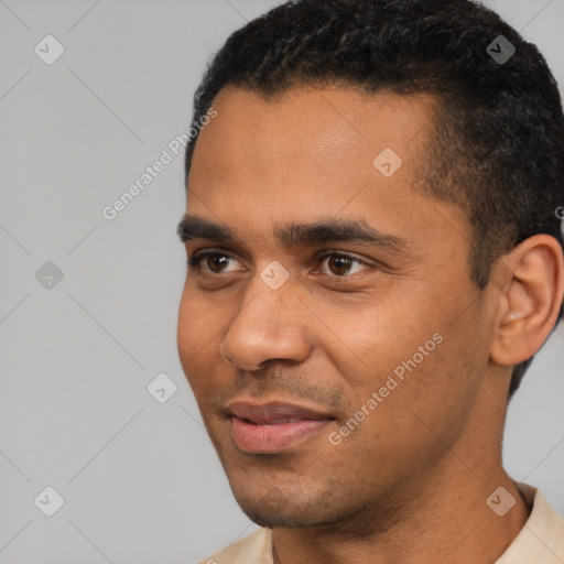 Joyful black young-adult male with short  black hair and brown eyes