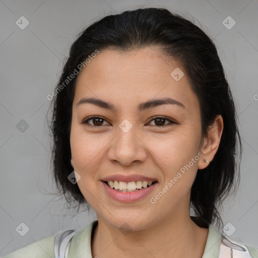 Joyful latino young-adult female with medium  brown hair and brown eyes