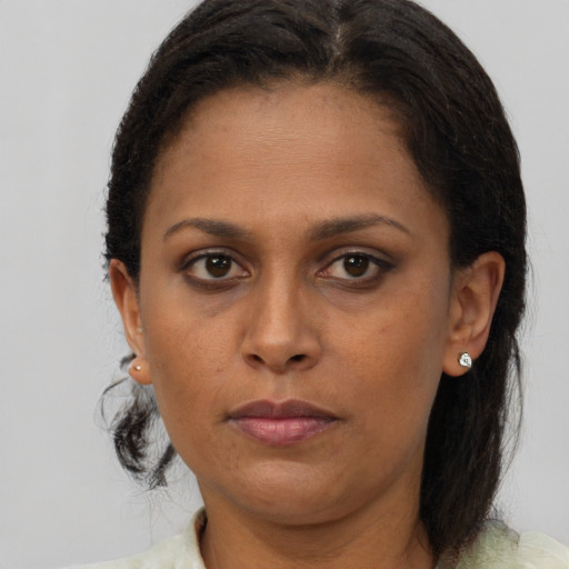 Neutral black adult female with short  brown hair and brown eyes