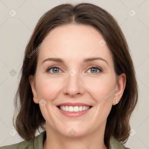 Joyful white young-adult female with medium  brown hair and green eyes