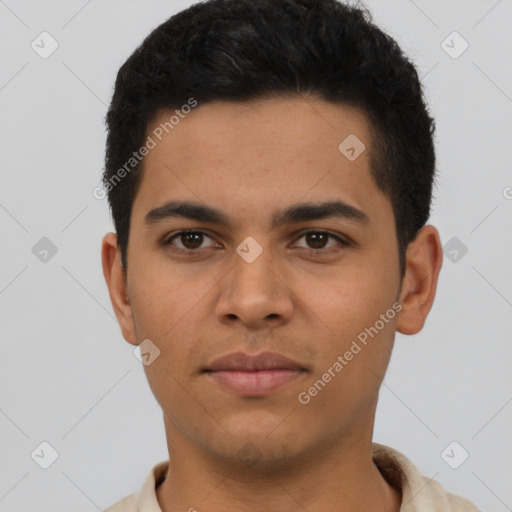 Neutral latino young-adult male with short  brown hair and brown eyes