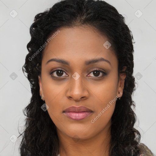 Joyful black young-adult female with long  brown hair and brown eyes