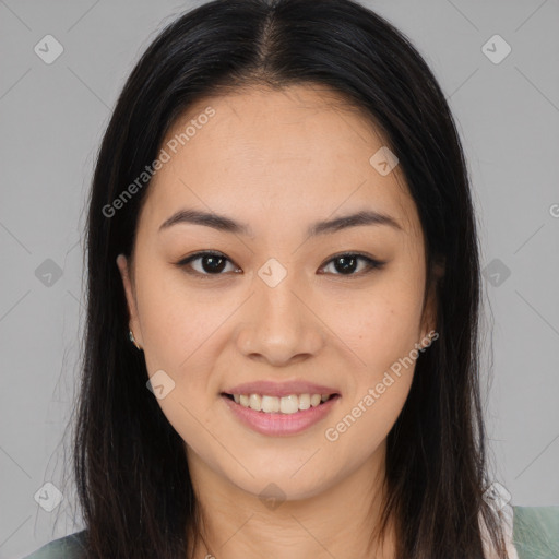 Joyful asian young-adult female with long  brown hair and brown eyes