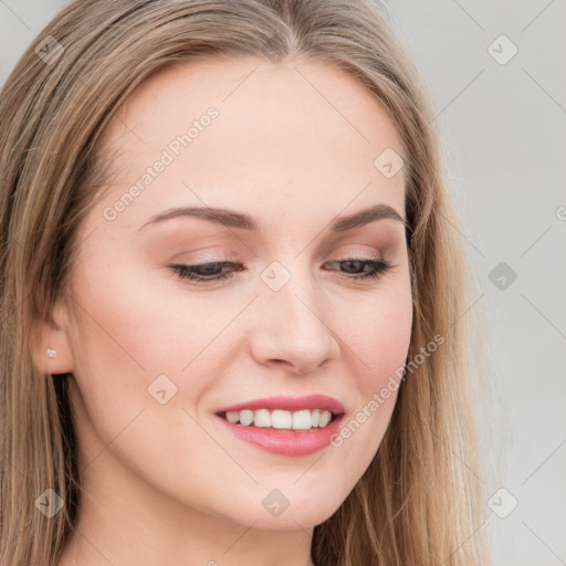 Joyful white young-adult female with long  brown hair and blue eyes