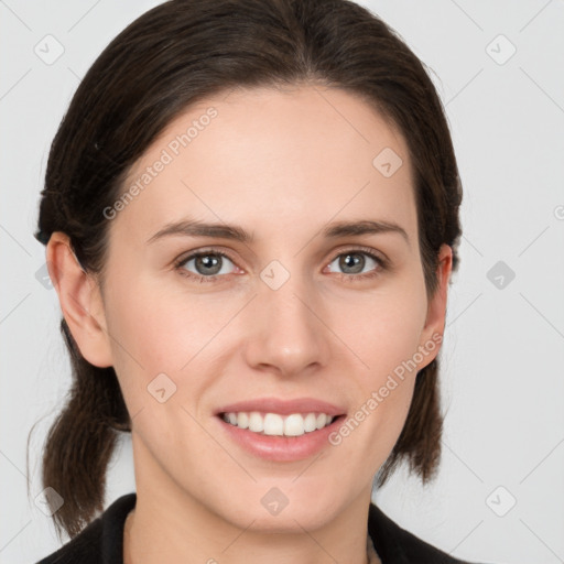 Joyful white young-adult female with medium  brown hair and grey eyes