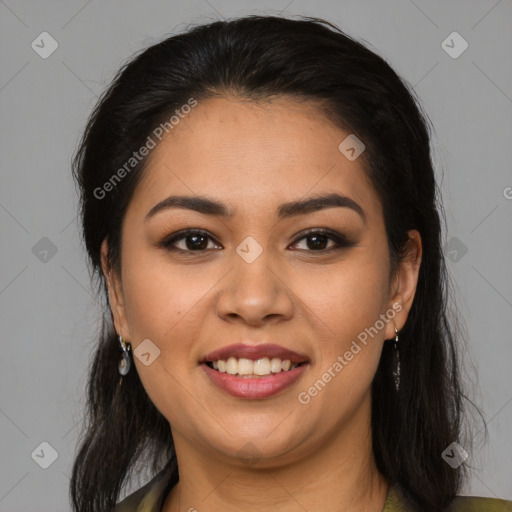 Joyful latino young-adult female with long  brown hair and brown eyes