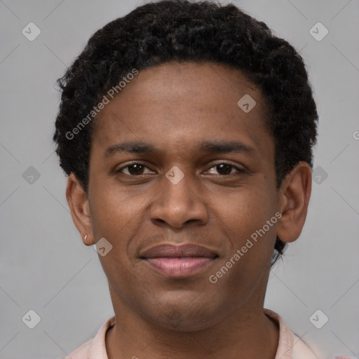 Joyful latino young-adult male with short  brown hair and brown eyes