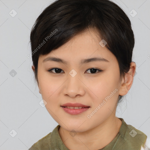 Joyful asian young-adult female with medium  black hair and brown eyes