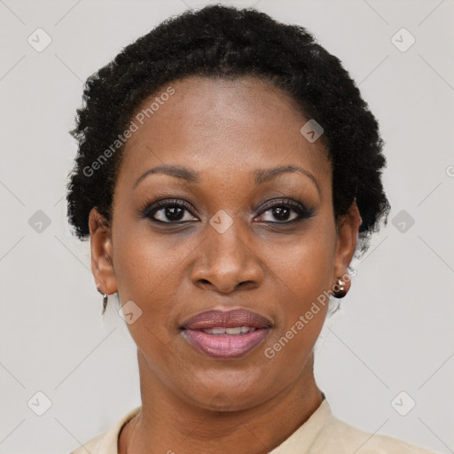 Joyful black adult female with short  black hair and brown eyes