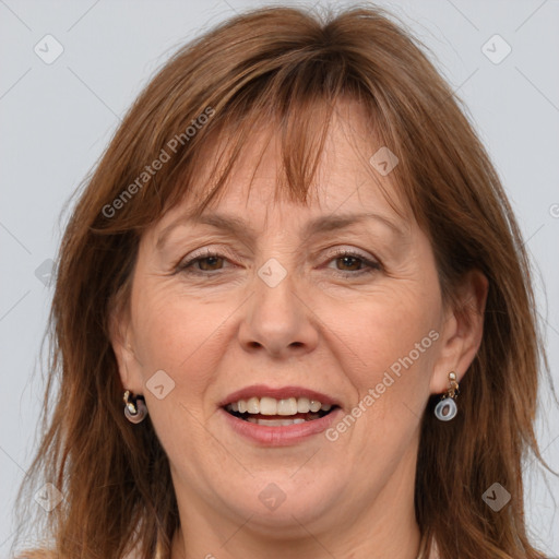 Joyful white adult female with long  brown hair and grey eyes