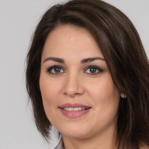 Joyful white young-adult female with medium  brown hair and brown eyes