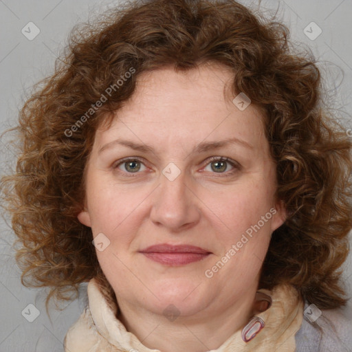 Joyful white adult female with medium  brown hair and blue eyes