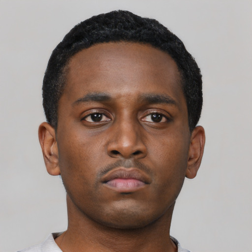 Neutral black young-adult male with short  black hair and brown eyes