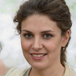 Joyful white young-adult female with medium  brown hair and brown eyes