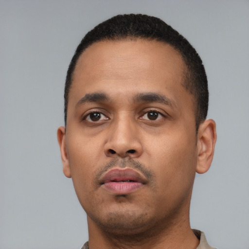 Neutral black young-adult male with short  black hair and brown eyes
