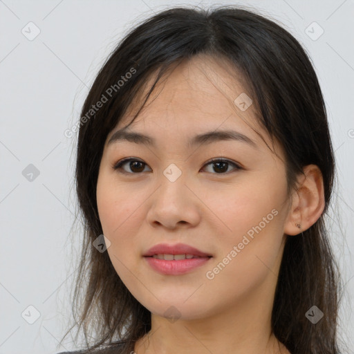 Joyful asian young-adult female with long  brown hair and brown eyes