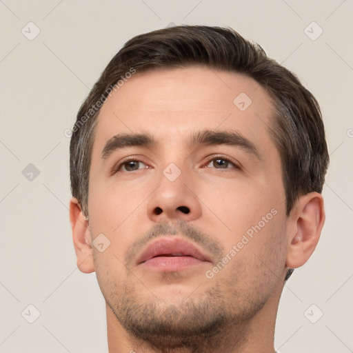 Neutral white young-adult male with short  brown hair and brown eyes