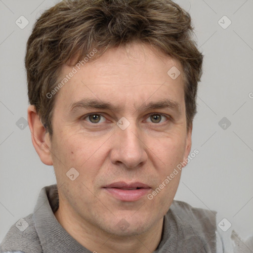 Joyful white adult male with short  brown hair and grey eyes