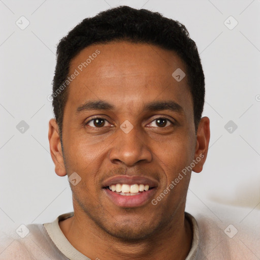 Joyful black young-adult male with short  brown hair and brown eyes