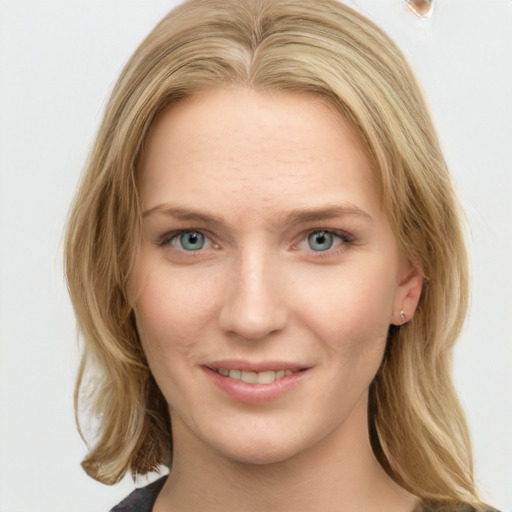 Joyful white young-adult female with medium  brown hair and blue eyes