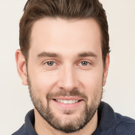 Joyful white young-adult male with short  brown hair and brown eyes