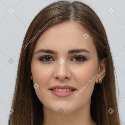 Joyful white young-adult female with long  brown hair and brown eyes