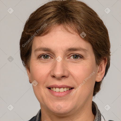 Joyful white adult female with medium  brown hair and grey eyes