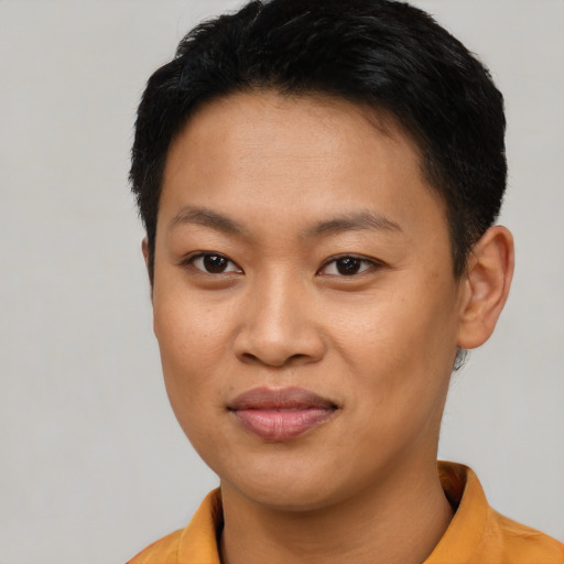 Joyful asian young-adult female with short  black hair and brown eyes