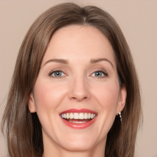 Joyful white young-adult female with medium  brown hair and grey eyes