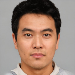 Neutral asian young-adult male with short  black hair and brown eyes