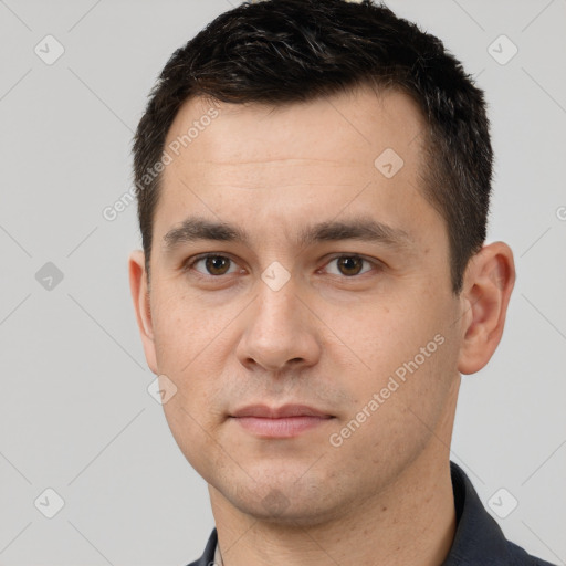 Neutral white young-adult male with short  brown hair and brown eyes