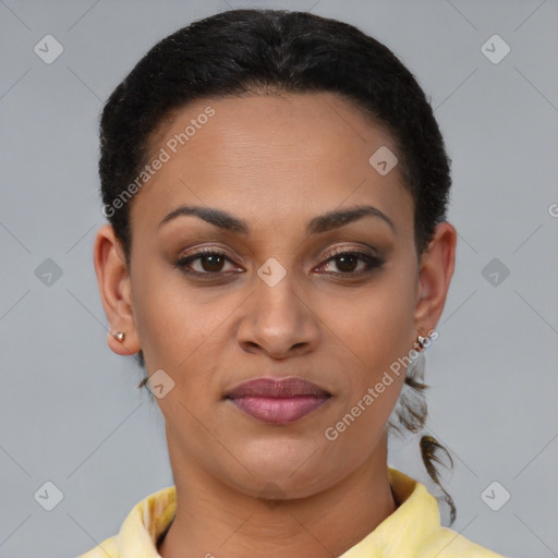 Joyful black young-adult female with short  brown hair and brown eyes