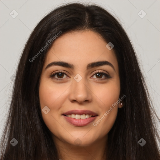 Joyful latino young-adult female with long  brown hair and brown eyes