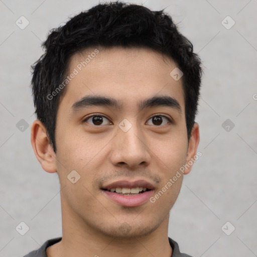 Joyful latino young-adult male with short  brown hair and brown eyes