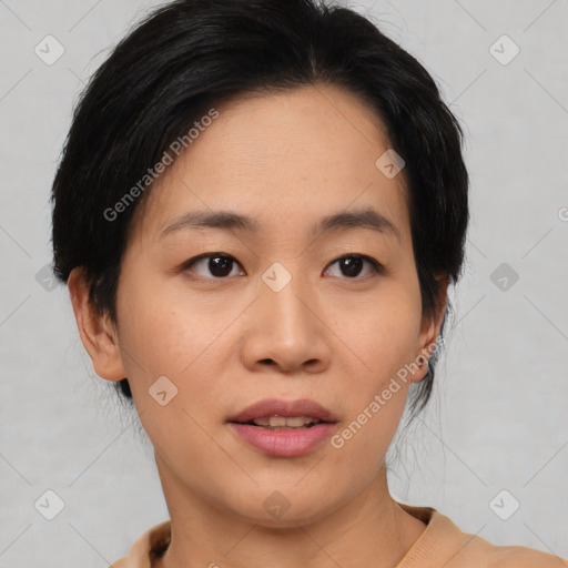 Joyful asian young-adult female with medium  black hair and brown eyes