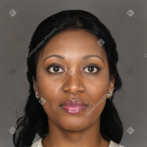 Joyful black young-adult female with long  black hair and brown eyes