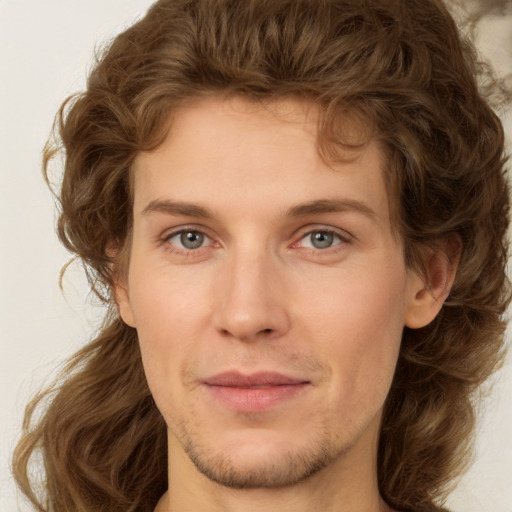 Joyful white young-adult male with medium  brown hair and brown eyes