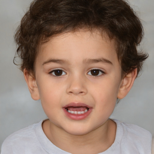 Joyful white child male with short  brown hair and brown eyes