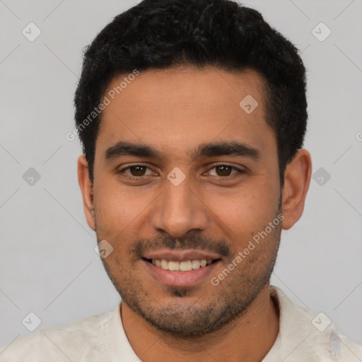 Joyful latino young-adult male with short  black hair and brown eyes