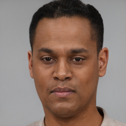 Neutral black young-adult male with short  black hair and brown eyes