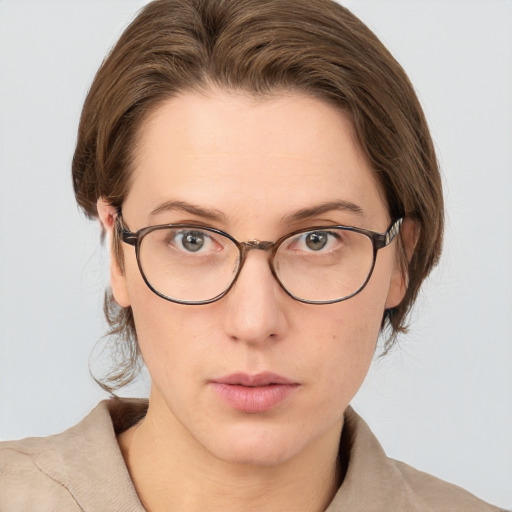 Neutral white young-adult female with medium  brown hair and grey eyes