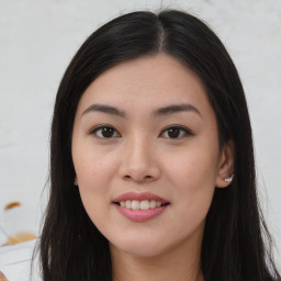 Joyful asian young-adult female with long  brown hair and brown eyes