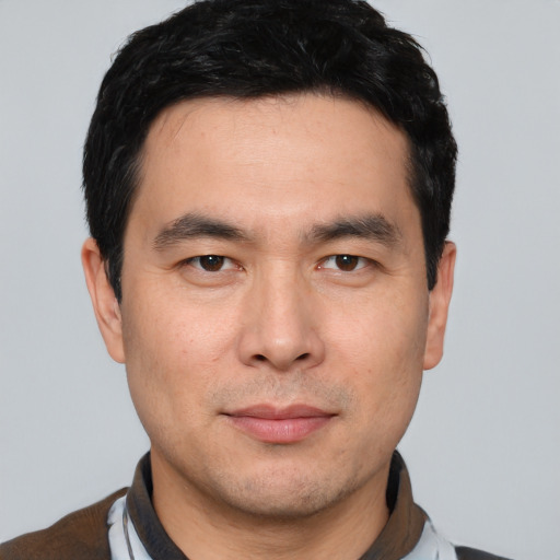 Neutral asian young-adult male with short  black hair and brown eyes