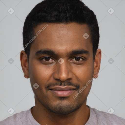 Joyful black young-adult male with short  black hair and brown eyes