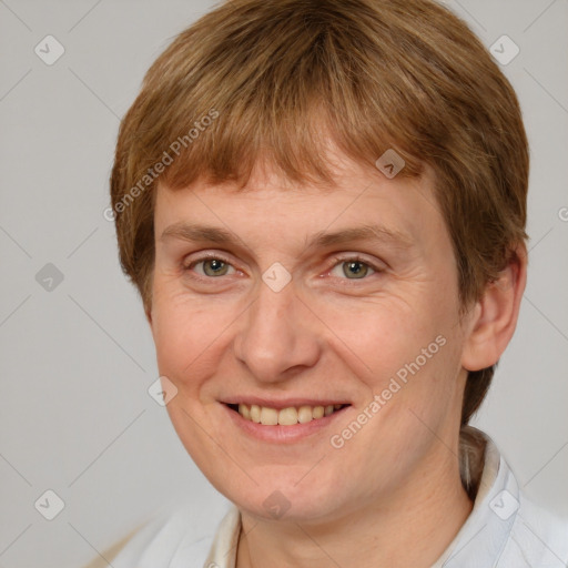 Joyful white adult female with short  brown hair and grey eyes